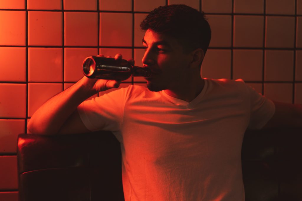 man drinking alcohol